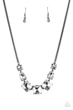 Load image into Gallery viewer, A trio of brilliant white square cut gems encased in classic gunmetal fittings takes center stage. Teardrop and round gems link to a gunmetal chain on either side of the trio for a striking display below the collar. Features an adjustable clasp closure.
