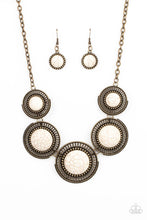 Load image into Gallery viewer, Earthy white stones, pressed into round antiqued brass frames featuring dot and interlinking loop motifs, create a dramatically rustic statement as they link across the collar. Features an adjustable clasp closure.
