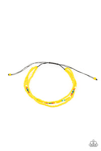 Two strands of dainty Illuminating seed beads, highlighted with a strand of brightly colored beads, form a simple accent around the wrist. Features an adjustable sliding knot closure.