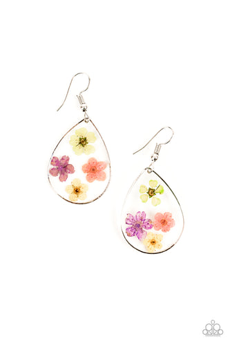 Dainty green, pink, purple, and yellow flowers are encased in a glassy teardrop, creating a whimsical frame. Earring attaches to a standard fishhook fitting.