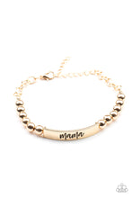 Load image into Gallery viewer, Stamped in the word, &quot;Mama,&quot; a curved gold plate attaches to strands of gold beads threaded along invisible wire around the wrist, creating a sentimental centerpiece. Features an adjustable clasp closure.
