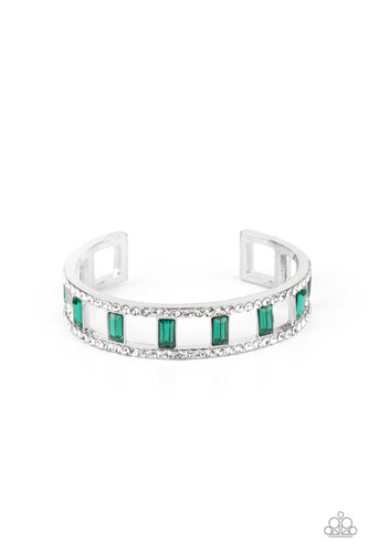 Bands of glittery white rhinestones overlaid on silver frames create an airy channel-like framework. Elegant baguette style cut green gems, connected to the glittery framework, circle around the wrist for a romantically decadent cuff bracelet.