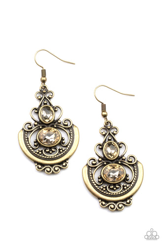 Oval golden rhinestones embellish an ornate brass frame swirling with studded and textured brass filigree, coalescing into an elegant lure. Earring attaches to a standard fishhook fitting