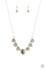 Load image into Gallery viewer, Encased in sleek silver fittings, elegant cut golden topaz rhinestones delicately connect below the collar. An oversized golden topaz rhinestone adorns to the middle of the glittery strand, creating a sparkly centerpiece. Features an adjustable clasp closure.
