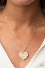 Load image into Gallery viewer, Infused with a glassy white rhinestone encrusted gold heart, a gold heart shaped pendant is stamped in the word, &quot;Mom,&quot; as it swings below the collar, creating a sparkly sentimental statement piece. Features an adjustable clasp closure.
