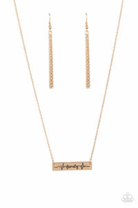 The word "Family," is inscribed between symbolic life lines on a shining rectangular gold plate creating an affectionate keepsake on a dainty gold chain below the collar. Features an adjustable clasp closure.
