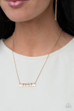 Load image into Gallery viewer, The word &quot;Family,&quot; is inscribed between symbolic life lines on a shining rectangular gold plate creating an affectionate keepsake on a dainty gold chain below the collar. Features an adjustable clasp closure.
