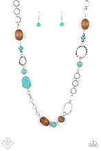 Load image into Gallery viewer, A mismatched assortment of turquoise stones, wooden beads, and silver accents sporadically adorn a double-linked silver chain, creating an earthy display across the chest. Features an adjustable clasp closure.  Sold as one individual necklace. Includes one pair of matching earrings.  New Kit Fashion Fix
