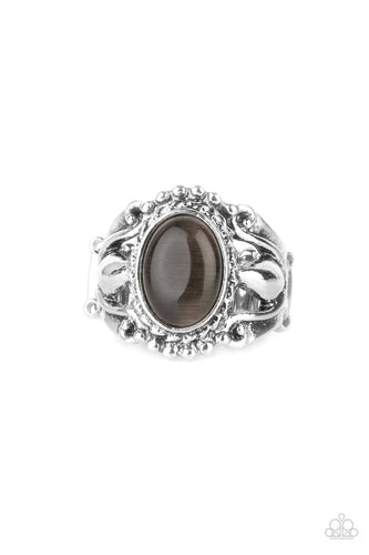 A smoky cat's eye stone creates a jubilant statement as it rests inside a studded silver frame atop an airy pedestal like band. Features a stretchy band for a flexible fit.