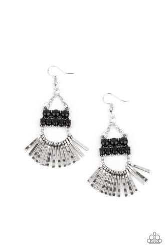 A row of delicately hammered silver rods fans out along a dainty silver wire that attaches to the bottom of stacked rows of shining black beads. The mismatched rows of beads swing from the bottom of dainty silver chains, coalescing into an ethereally rustic chandelier. Earring attaches to a standard fishhook fitting.