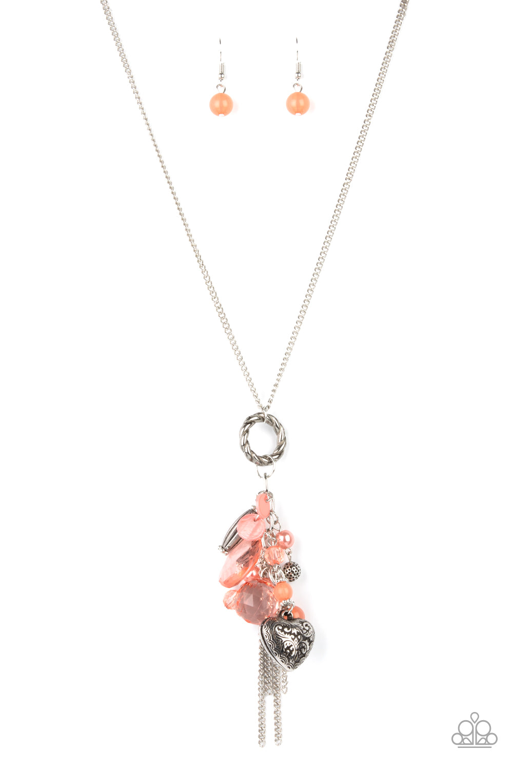 Varying glassy, pearly, opaque, and shell-like finishes, a whimsical collection of crystal-like and classic Burnt Coral beads delicately cluster along a chunky silver chain swinging from the bottom of a textured silver ring. Mismatched silver beads, classic silver chains, and a decorative silver locket-like bead are added to the fringe, creating an enchanted tasseled pendant at the bottom of a classic silver chain. Features an adjustable clasp closure. 