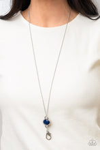 Load image into Gallery viewer, Bordered in a silver frame filled with glassy white rhinestones, a faceted Navy Blue bead creates a glamorous pendant at the bottom of a lengthened dainty silver chain.  A lobster clasp hangs from the bottom of the design to allow a name badge or other item to be attached. Features an adjustable clasp closure. 
