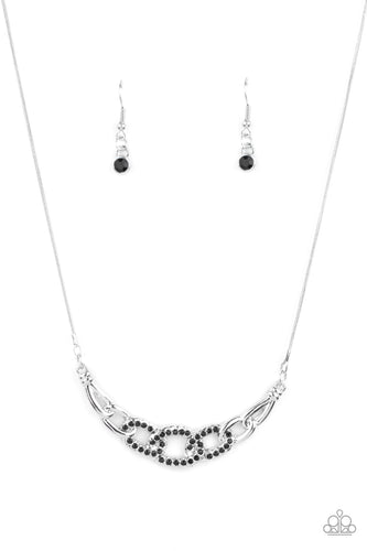 Shiny silver links, encrusted with dainty Jet Black rhinestones, connect into a glamorous centerpiece below the collar. Features an adjustable clasp closure. 