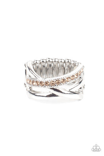  Bands of crisscrossing shining silver bars are highlighted by a row of glittering light topaz rhinestones for a ritzy finish across the finger. Features a stretchy band for a flexible fit.