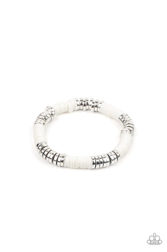 Stacks of rubbery white discs and bold silver rings are threaded along a stretchy band around the wrist, creating a versatile pop of color.