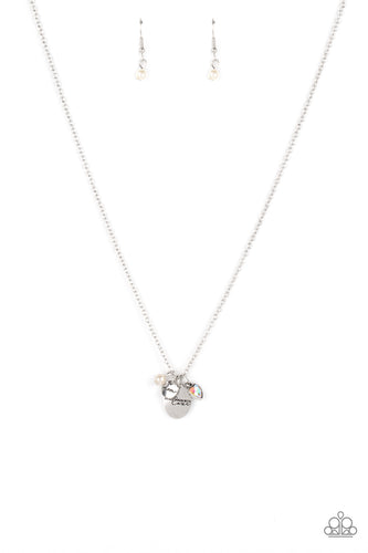 A whimsical charm collection including, a white pearl, iridescent rhinestone heart, a dainty silver disc stamped in the word, 