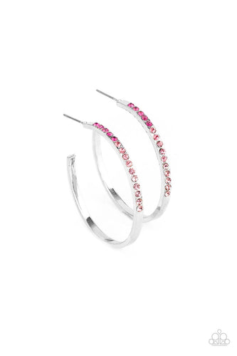 The front half of a dainty silver hoop is encrusted in an ombre of pink rhinestones, creating a sparkly spectrum of color. Earring attaches to a standard post fitting. Hoop measures approximately 1 1/2