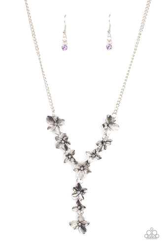 Dotted with dainty purple rhinestone centers, whimsical silver flowers delicately link into an extended pendant below the collar for an ethereal fashion. Features an adjustable clasp closure.
