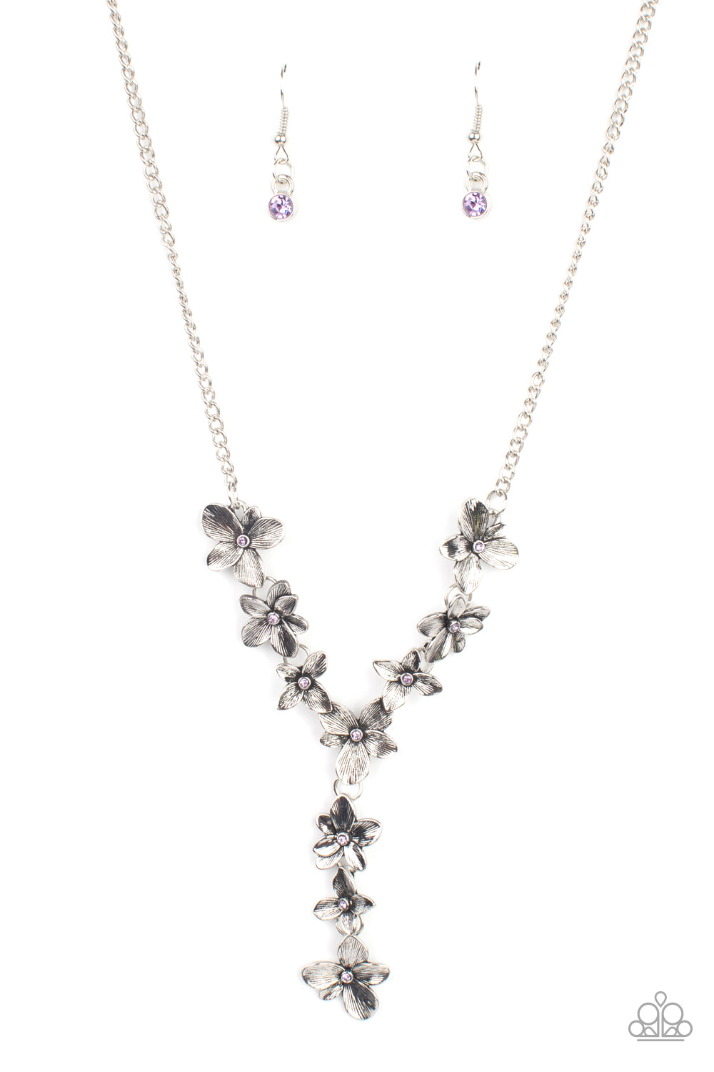 Dotted with dainty purple rhinestone centers, whimsical silver flowers delicately link into an extended pendant below the collar for an ethereal fashion. Features an adjustable clasp closure.