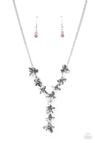 Dotted with dainty multicolored rhinestone centers, whimsical silver flowers delicately link into an extended pendant below the collar for an ethereal fashion. Features an adjustable clasp closure. 