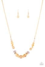 Load image into Gallery viewer, Varying in opacity, an enchanting collection of iridescent and crystal-like beads are threaded along an invisible wire that is attached to a gold chain below the collar. Mismatched gold beads and ornate gold accents are sprinkled between the glittery compilation, adding a whimsy sheen to the colorful statement piece. Features an adjustable clasp closure.
