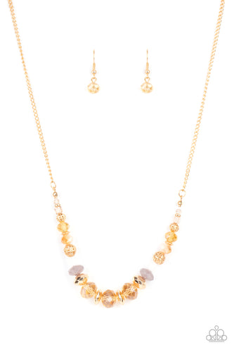 Varying in opacity, an enchanting collection of iridescent and crystal-like beads are threaded along an invisible wire that is attached to a gold chain below the collar. Mismatched gold beads and ornate gold accents are sprinkled between the glittery compilation, adding a whimsy sheen to the colorful statement piece. Features an adjustable clasp closure.