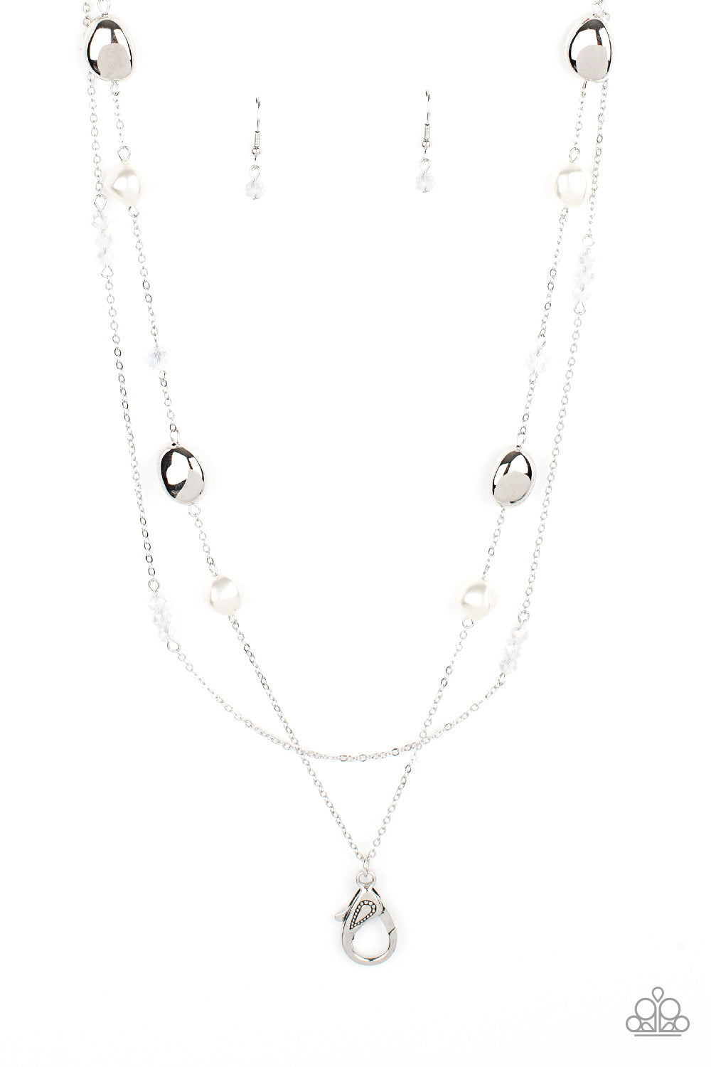 A dainty silver chain adorned in trios of iridescent flecked crystal-like beads layers with a chain dotted with matching crystal-like accents and imperfect silver and pearly white beads across the chest for a refined flair. A lobster clasp hangs from the bottom of the design to allow a name badge or other item to be attached. Features an adjustable clasp closure.  Sold as one individual lanyard. Includes one pair of matching earrings.