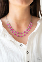 Load image into Gallery viewer, Encased in studded silver frames, two rows of oval pink stones delicately connect below the collar for a vivacious pop of color. Features an adjustable clasp closure.
