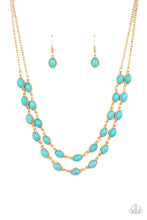 Load image into Gallery viewer, Encased in studded gold frames, two rows of oval turquoise stones delicately connect below the collar for a seasonal flair. Features an adjustable clasp closure. 
