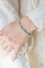 Load image into Gallery viewer, Encased in studded gold frames, oval turquoise stones delicately connect around the wrist for a seasonal flair. Features an adjustable clasp closure. 
