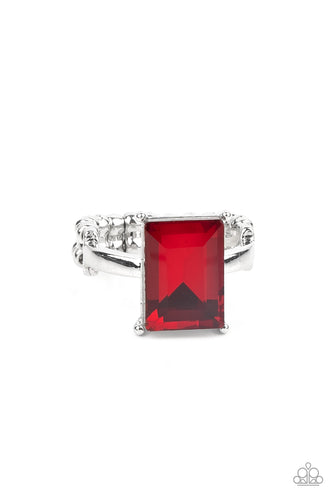 A fiery emerald cut gem is nestled inside a pronged silver frame atop a dainty silver band, creating a sparkly statement atop the finger. Features a dainty stretchy band for a flexible fit.