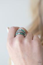 Load image into Gallery viewer, Two bands of emerald cut green rhinestones flank a twisted silver bar across the finger, creating an edgy layered centerpiece. Features a stretchy band for a flexible fit.
