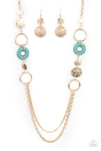 Load image into Gallery viewer, An earthy collection of hammered gold discs, turquoise stone accents, and bold gold hoops link with sections of chunky and mismatched gold chains across the chest, creating a seasonal display. Features an adjustable clasp closure.
