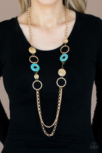 Load image into Gallery viewer, An earthy collection of hammered gold discs, turquoise stone accents, and bold gold hoops link with sections of chunky and mismatched gold chains across the chest, creating a seasonal display. Features an adjustable clasp closure.
