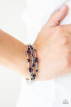 Load image into Gallery viewer, A smattering of glittery purple rhinestones adorn three silver bars that coalesce into a versatile silver cuff-like bangle around the wrist. Features a hinged closure.
