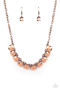 A succession of gleaming radiant-cut copper aurum gems attaches to a copper chain and falls below the collar for an edgy show-stopping display. Features an adjustable clasp closure.