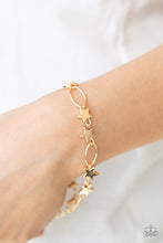 Load image into Gallery viewer, Dainty gold stars and airy gold ovals delicately link around the wrist, creating a stellar 4th of July display. Features an adjustable clasp closure.
