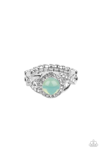 An opal green bead is pressed into the center of a ring of white rhinestones that sits atop interwoven silver bars dotted in dainty white rhinestones, creating an ethereally elegant centerpiece atop the finger. Features a dainty stretchy band for a flexible fit.