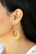 Load image into Gallery viewer, Brushed in a high sheen matte, a round gold frame is scratched in a gritty linear pattern for a rustic fashion. Earring attaches to a standard fishhook fitting.
