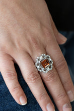 Load image into Gallery viewer, An airy flower-petal frame encrusted with brilliant white rhinestones highlights a stunning square-cut topaz gem. Set in silver pronged fittings the timeless gem sits center stage creating a charismatic display atop the finger. Features a dainty stretchy band for a flexible fit.
