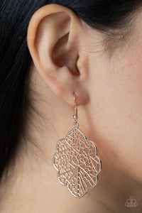 A scalloped rose gold leafy frame is filled with a backdrop of stenciled geometric accents, creating a whimsy seasonal display. Earring attaches to a standard fishhook fitting.