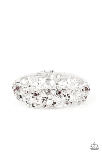 Dotted with dainty purple rhinestone centers, flowering leafy silver vines bloom into two oversized silver frames that delicately hinge into a versatile bangle-like bracelet. Features a hinged closure. 