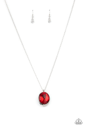 An oversized red gem is pressed into a sleek silver fitting dipped in dainty white rhinestones, creating a glamorous pendant at the bottom of a dainty silver chain. Features an adjustable clasp closure. 