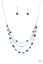 Load image into Gallery viewer, Infused with glassy blue beaded strands, layers of mismatched silver chains drape below the collar for an ethereal pop of color. Features an adjustable clasp closure. 
