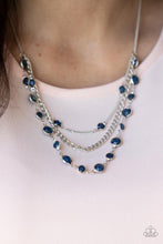 Load image into Gallery viewer, Infused with glassy blue beaded strands, layers of mismatched silver chains drape below the collar for an ethereal pop of color. Features an adjustable clasp closure. 
