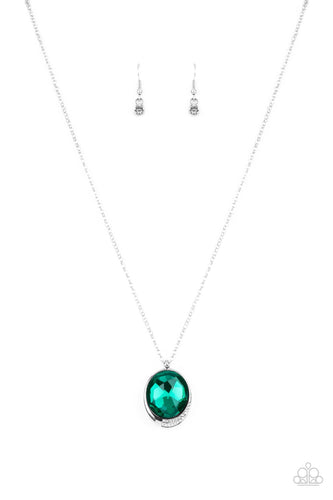 An oversized green gem is pressed into a sleek silver fitting dipped in dainty white rhinestones, creating a glamorous pendant at the bottom of a dainty silver chain. Features an adjustable clasp closure.