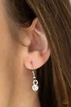 Load image into Gallery viewer, Infused with a dainty white rhinestone beaded accent, a striking silver star glides along a shiny silver chain below the collar, creating a stellar pendant. Features an adjustable clasp closure. 
