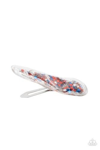 A stellar collection of shimmery red, silver, and blue stars sparkle back and forth inside a clear plastic frame, creating an eye-catching twinkle. Features a standard snap hair clip on the back.