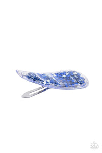A stellar collection of shimmery white and blue stars sparkle back and forth inside a clear plastic frame, creating an eye-catching twinkle. Features a standard snap hair clip on the back.