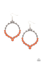 Load image into Gallery viewer, Ornate floral motifs decorate the top half of an airy circular silver frame. A row of dewy orange oval and round beads creates a border along the lower half of the frame, culminating in a single teardrop accent for a demurely enchanting lure. Earring attaches to a standard fishhook fitting. 
